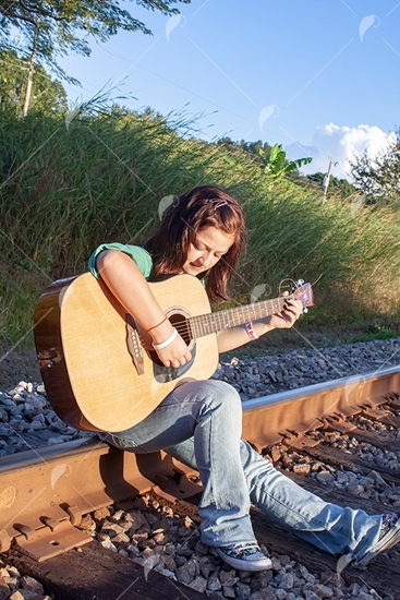 Picture of Teen Girl Playing Guitar