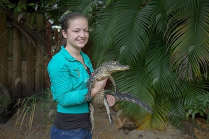 Picture of Teen Girl Holding Alligator