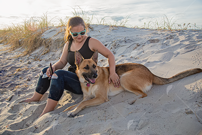 Picture of Youn Woman on the Beach With German Shepard