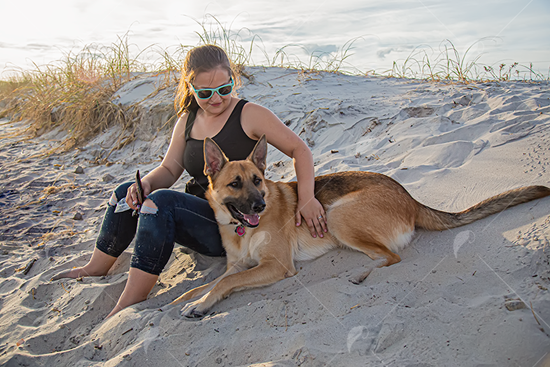 Picture of Youn Woman on the Beach With German Shepard