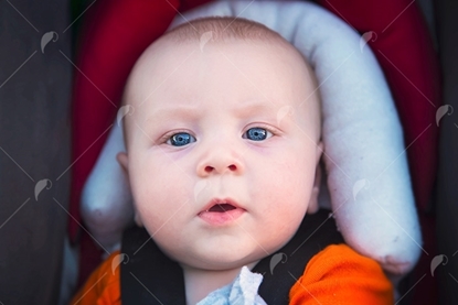 Picture of Blue Eyed Baby Boy In Car Seat
