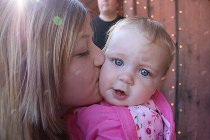 Picture of Girls Kissing Baby Girl
